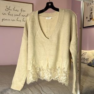 Storia v-neck sweater with lace trim on bottom. EUC